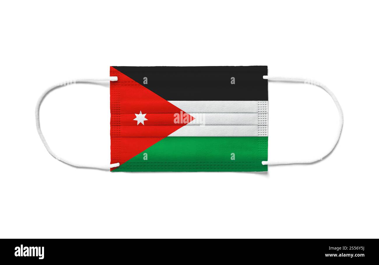 Flag of Jordan on a disposable surgical mask. White background isolated. Flag of Jordan on a disposable surgical mask. White background Stock Photo