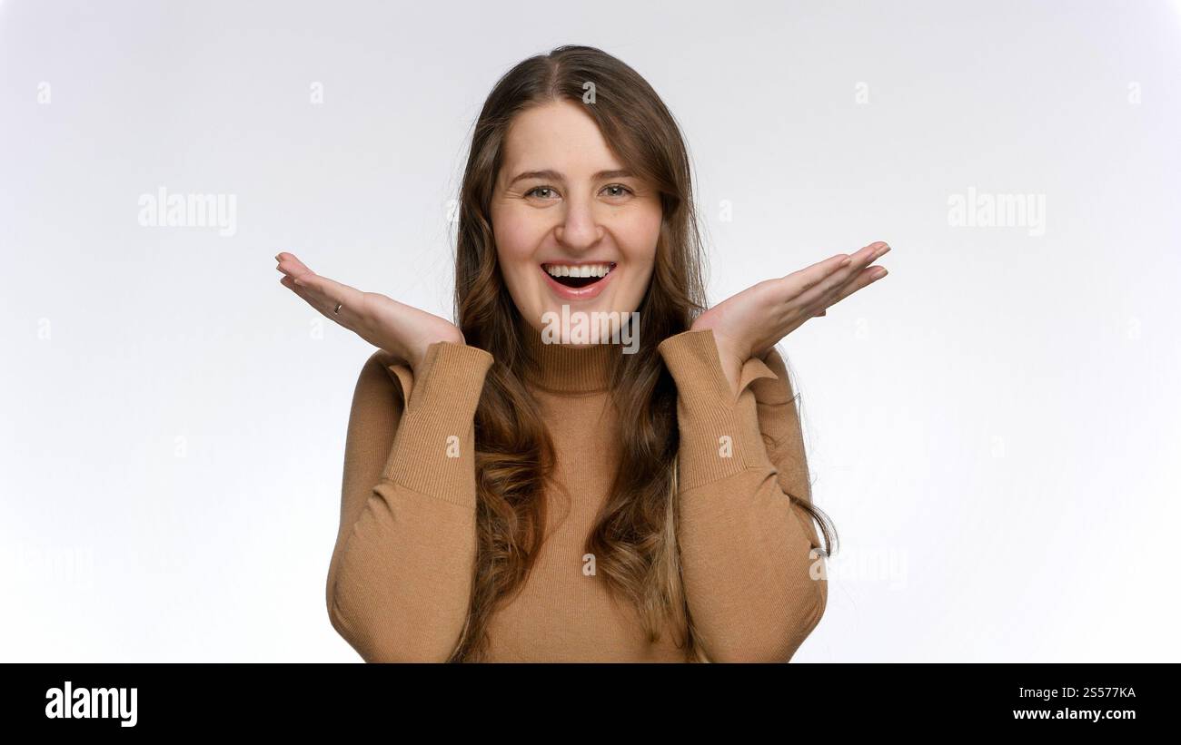 Portrait of amazed and shocked woman opening mouth and smiling ...
