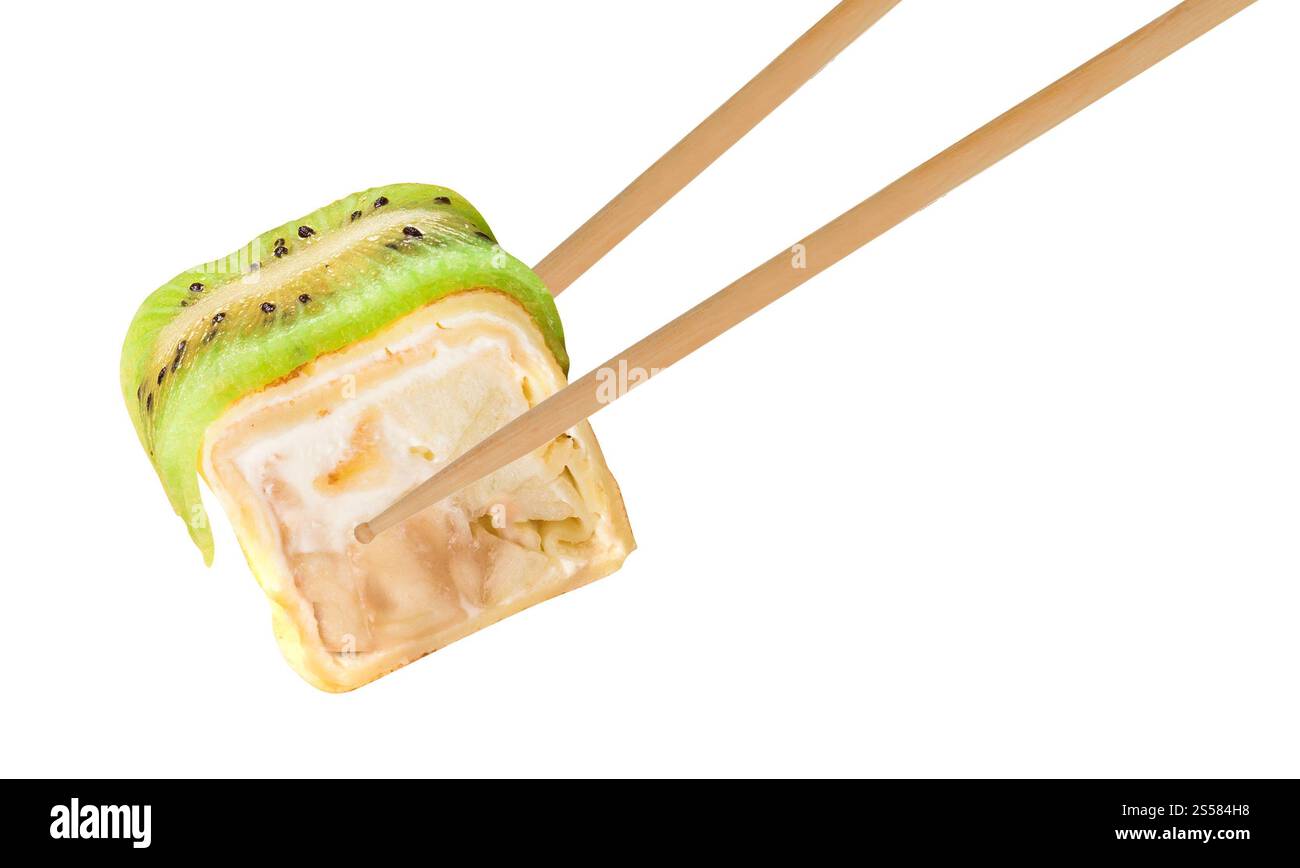 chopsticks holding sushi roll Stock Photo