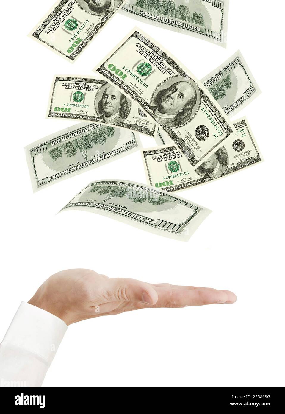 Hand and falling money isolated on white background Stock Photo - Alamy