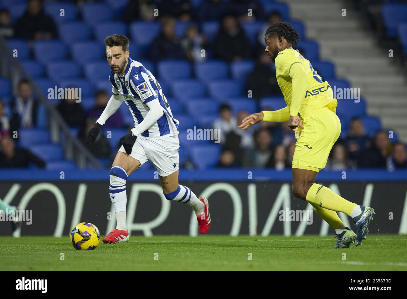 Brais Mendez of Real Sociedad and Willy Kambwala of Villarreal CF