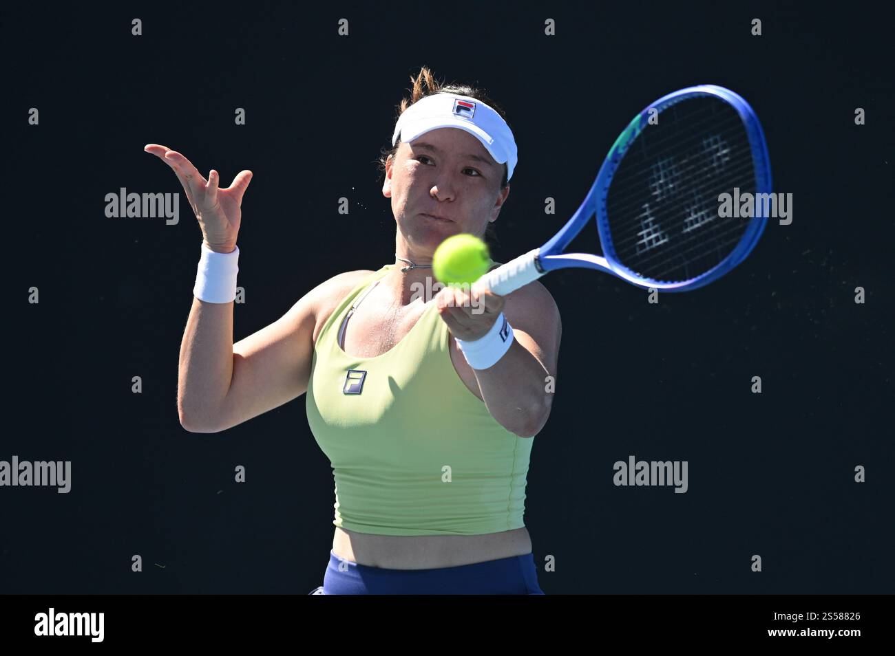 Lulu Sun of New Zealand returns during her round 1 match against Danka