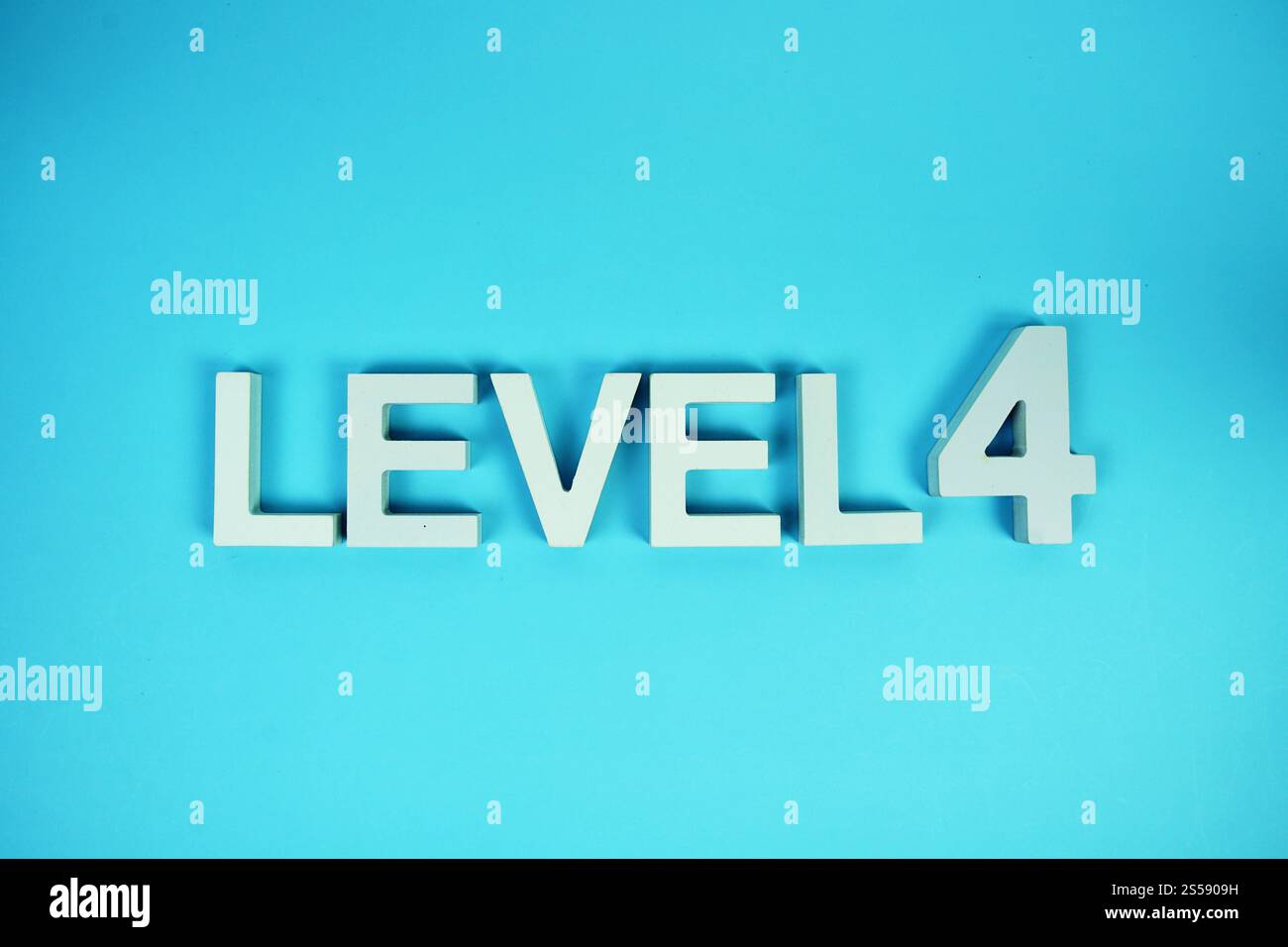 Level 4 Level Four alphabet letters on blue background Stock Photo - Alamy