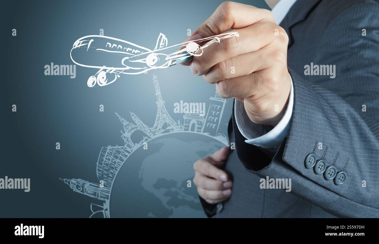 businessman hand draws dream travel around the world Stock Photo