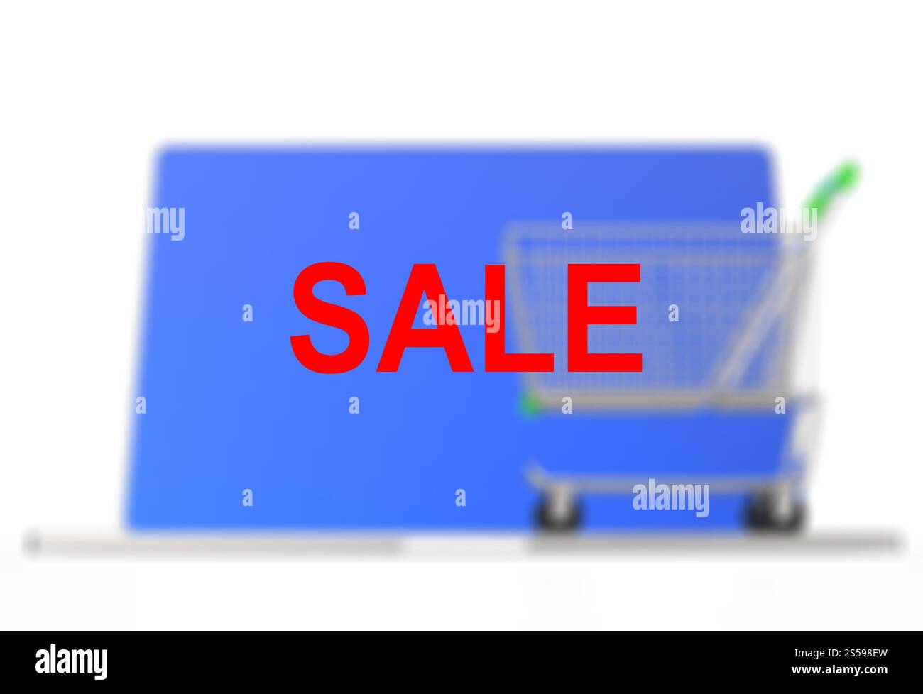 A shopping cart sits on a laptop to represent online shopping concept Stock Photo