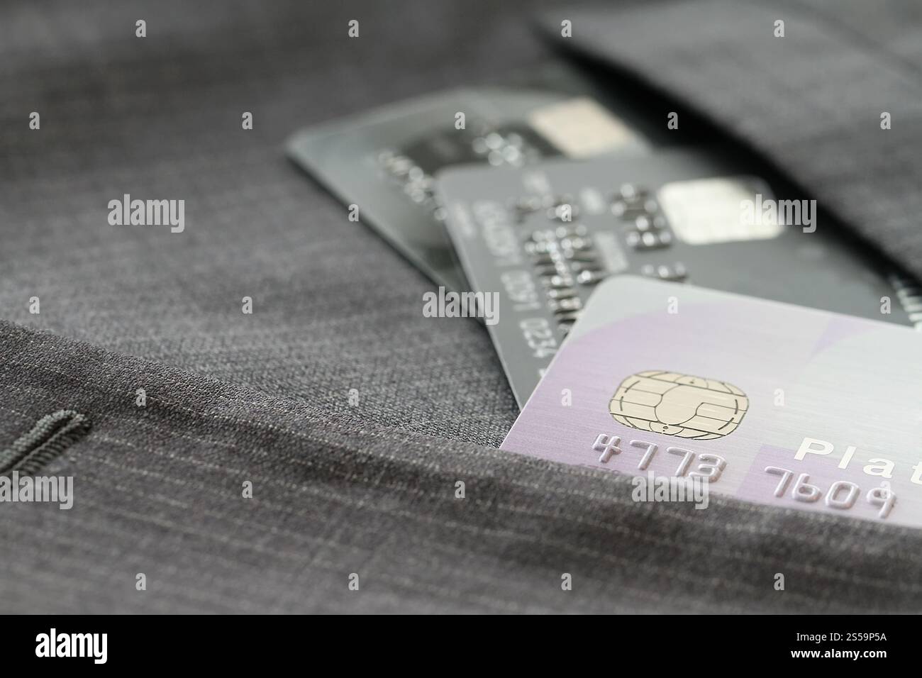 Credit cards in very shallow focus with gray suit background Stock Photo