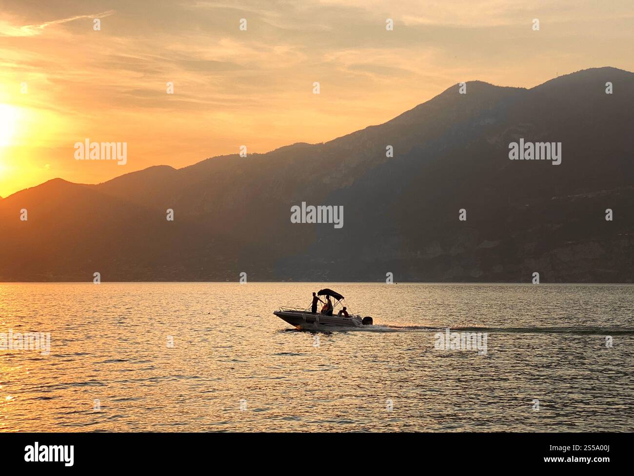 Boating in Lake Garda at sunset in Italy - Smartphone Captured Stock Image