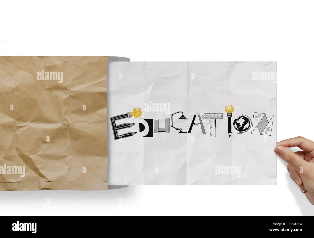 hand pulling crumpled paper from envelope with design word EDUCATION as concept Stock Photo