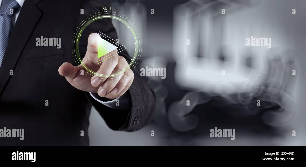 Businessman hand press play button sign to start or initiate projects ...