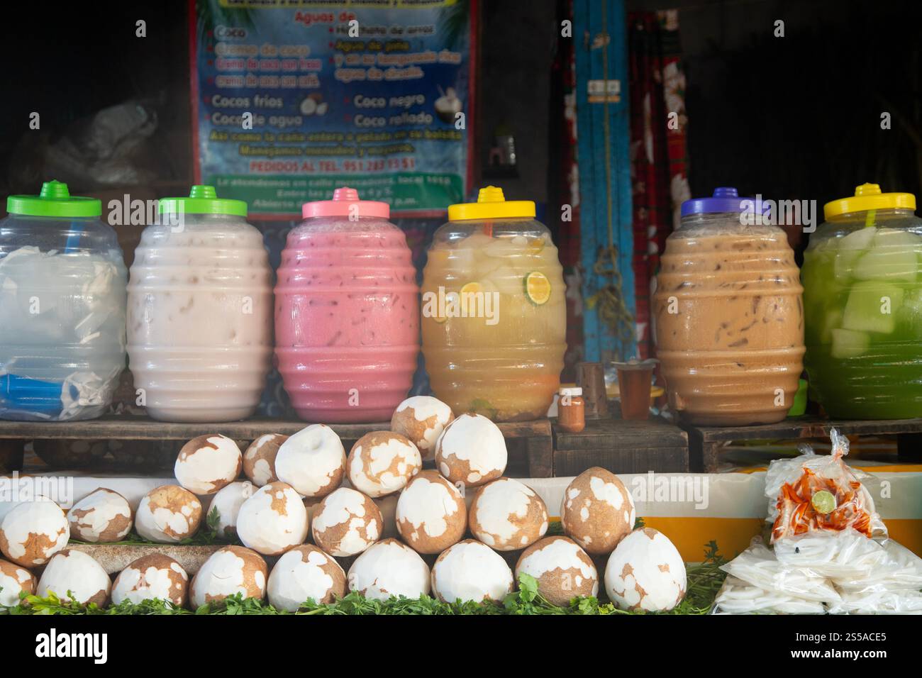 Refreshing Aguas Frescas and coconuts stall at the Abastos market in Oaxaca, Mexico. Stock Photo