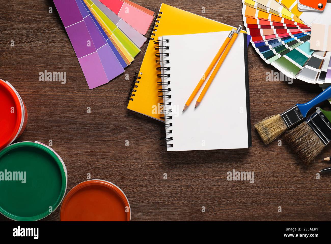 Flat lay composition with different painter's tools on wooden table. Decorating and design Stock Photo