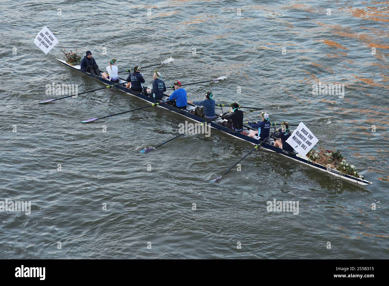 Roz Rows MPs and Olympians row past the Houses of Parliament in London as they ...