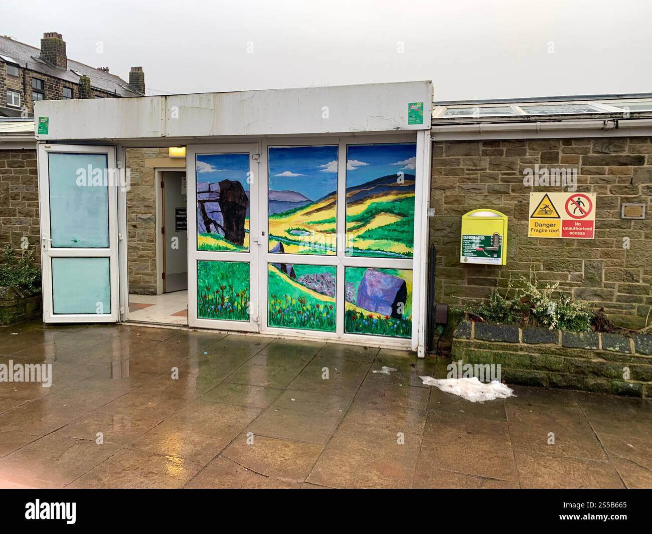 Ilkley Yorkshire England West Yorkshire toilet rain weather Electrical charging point sign signs water raining outside charger charging square toilet - Smartphone Captured Stock Image