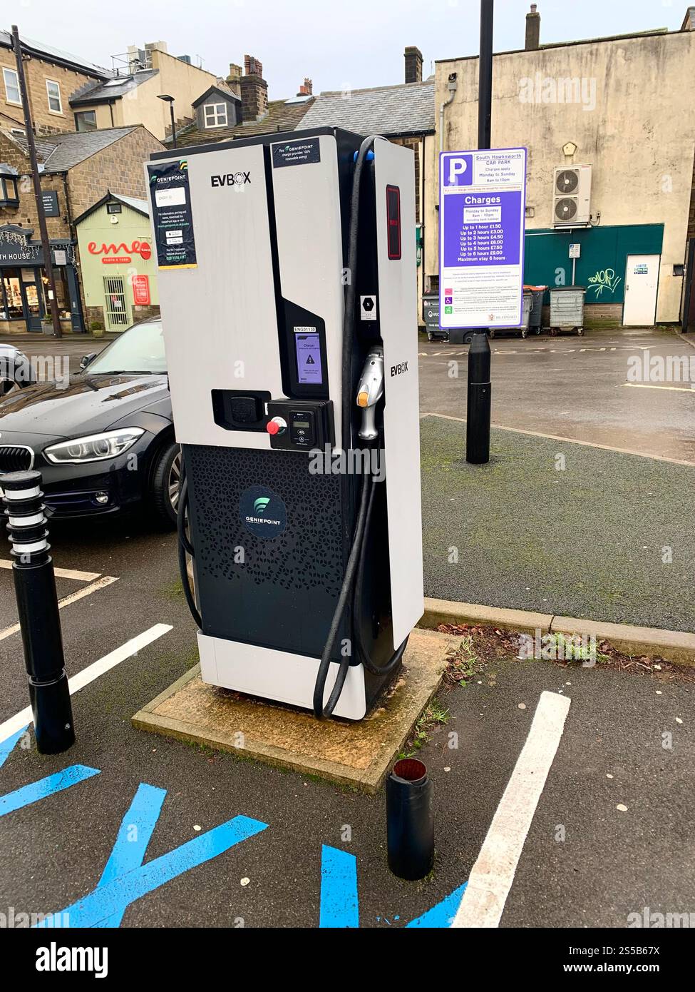 Ilkley Yorkshire England West Yorkshire toilet rain weather Electrical charging point sign signs water raining outside charger charging square signs - Smartphone Captured Stock Image
