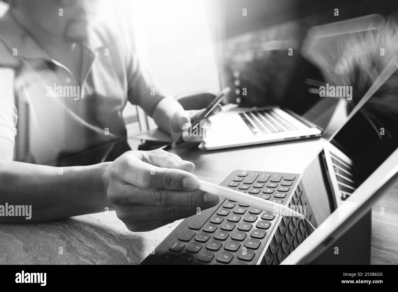 Outsource Developer working on marble Desk Working Laptop Computer ...