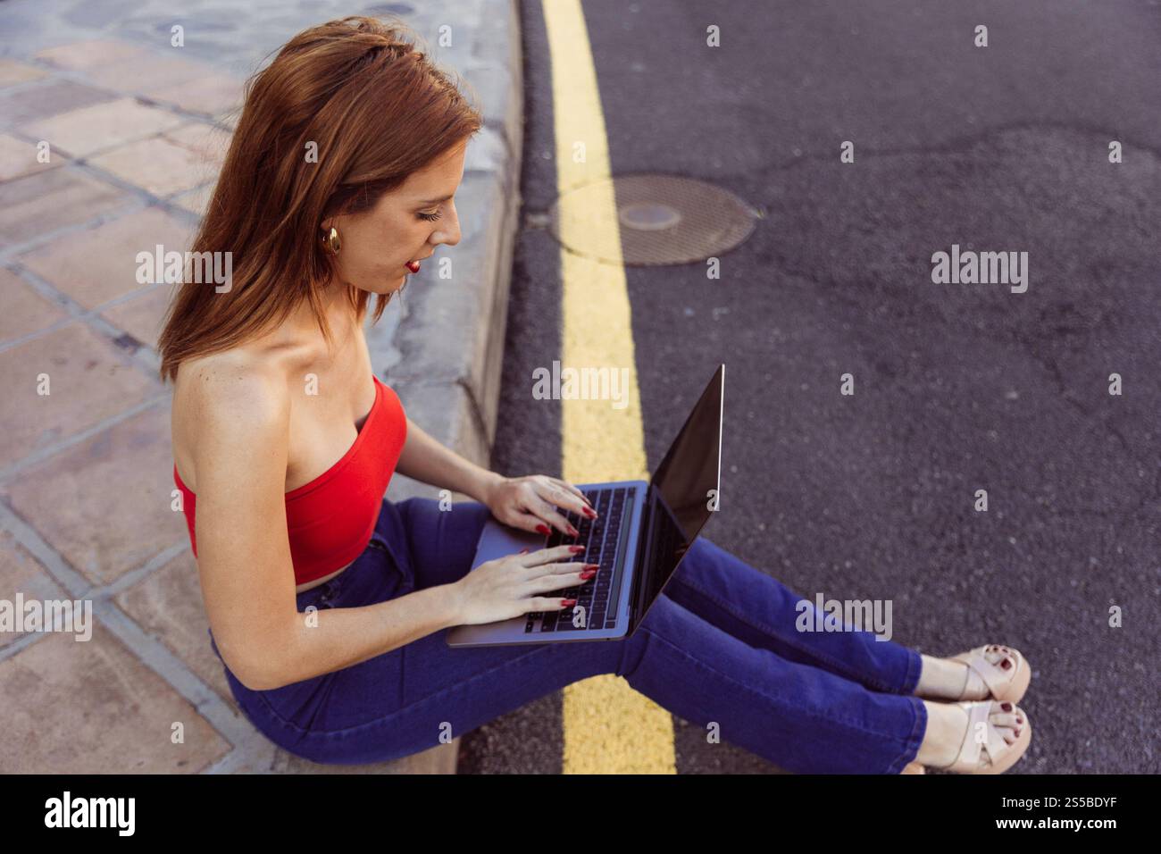 Wearing red top and blue jeans hi-res stock photography and images - Alamy