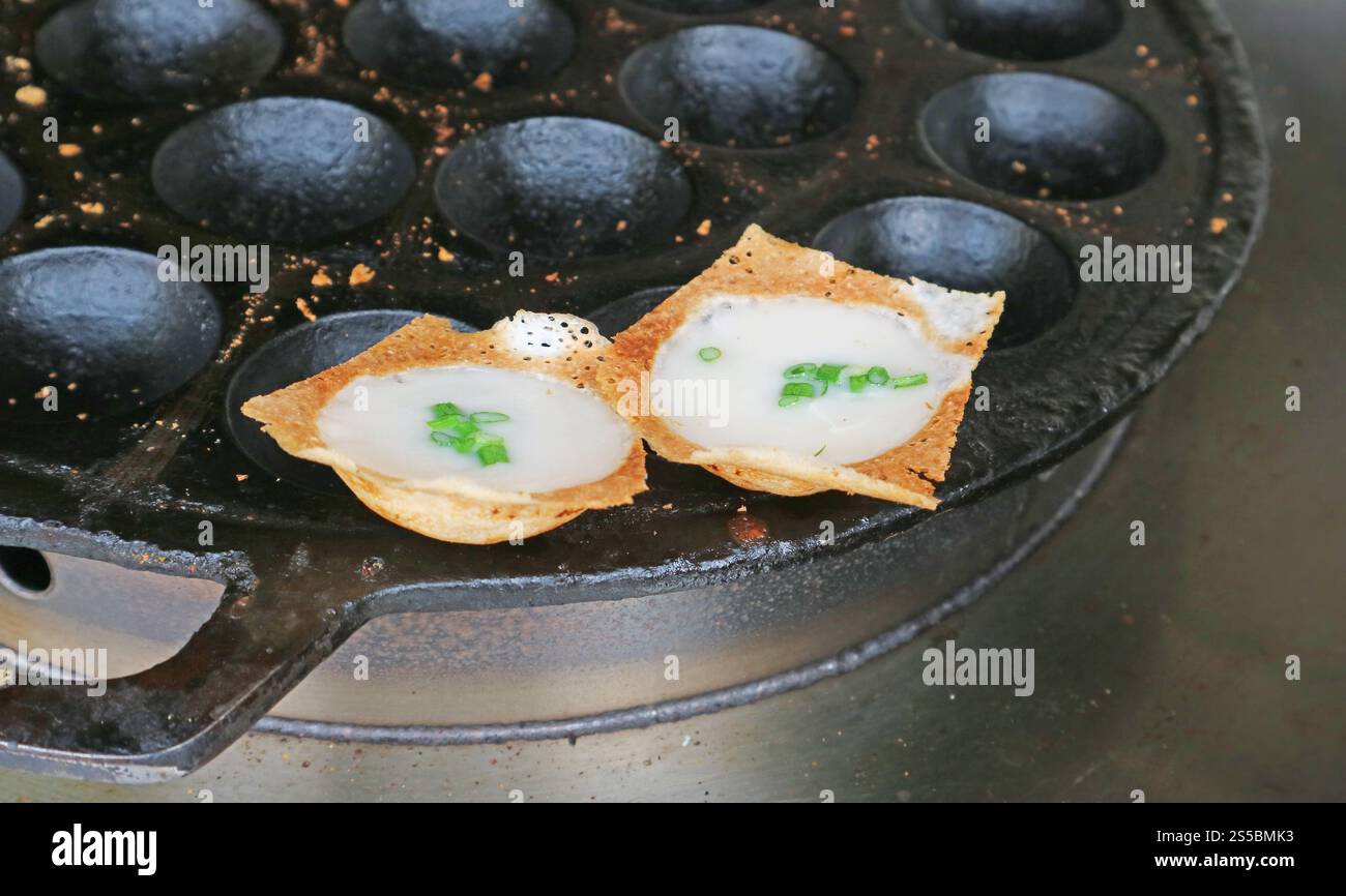 Kanom Krok with Spring Onion Topping, Thai coconut milk pancake which one of the popular street food in Thailand Stock Photo