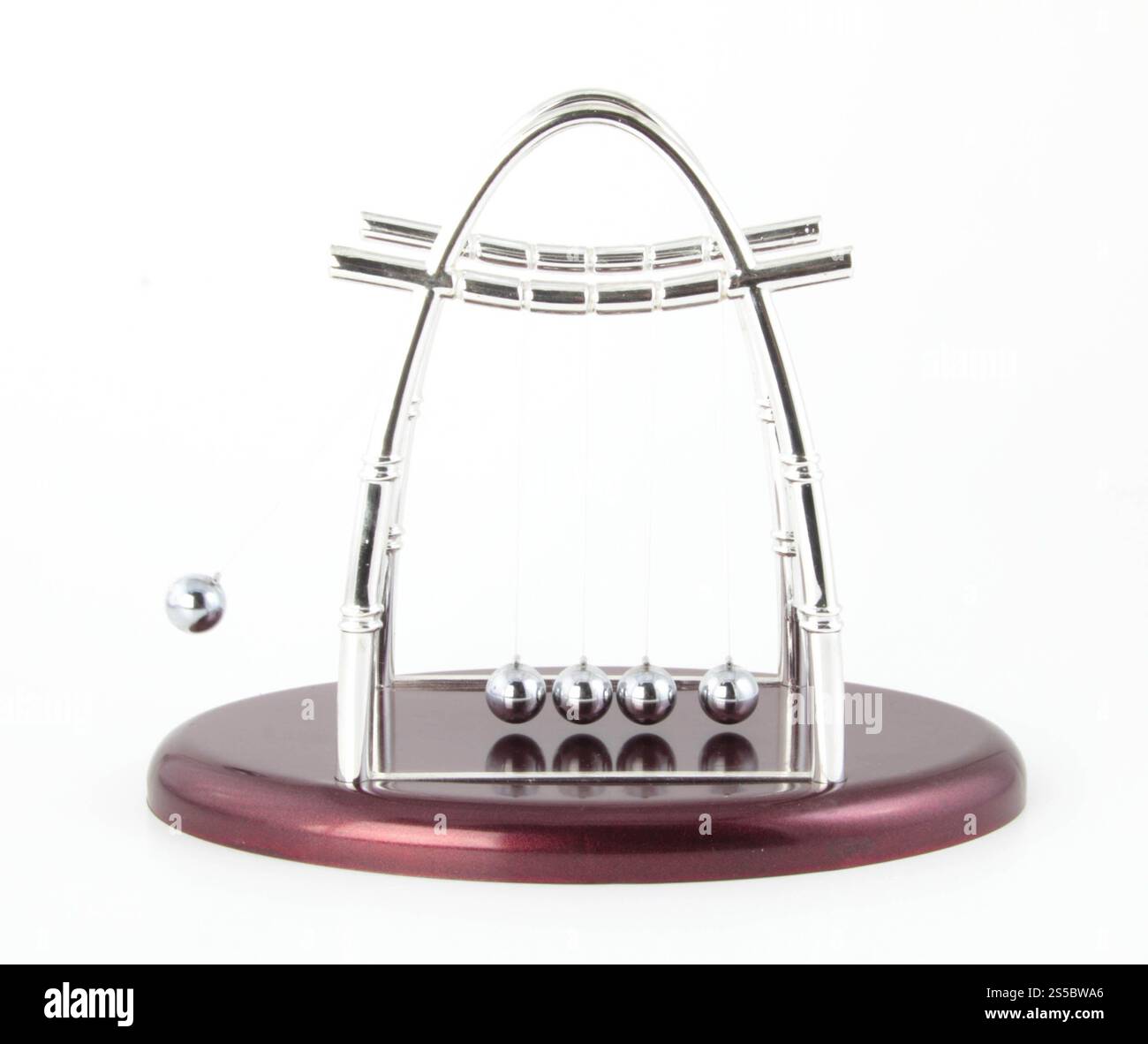 Newtons cradle isolated on white background. Newtons cradle isolated Stock Photo