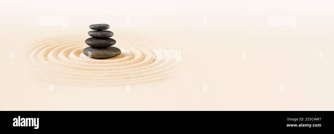 Black stones pile in the sand. Zen japanese garden background scene ...