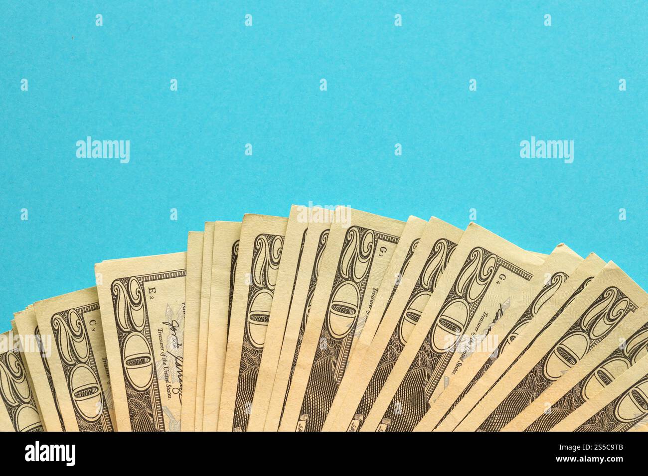 Old yellow mechanical clamshell grab on blue sky background Stock Photo