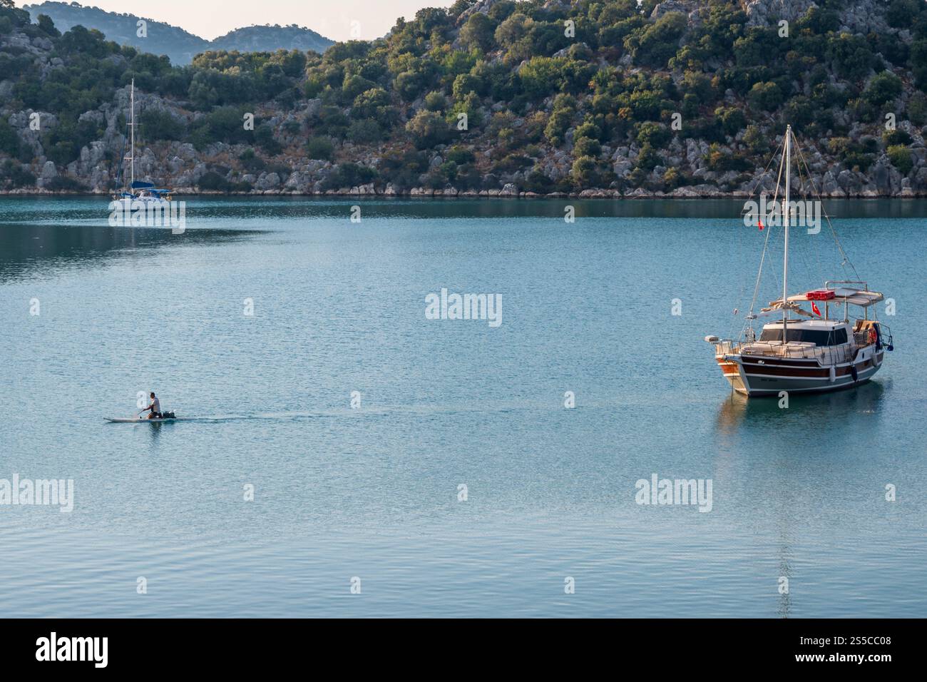 blue crurise boat anchored in the bay Stock Photo - Alamy