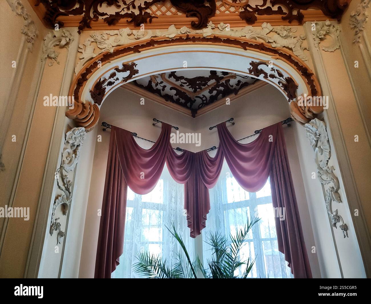 Pattern Onthe Window Antique window with curtains and patterns on the window and walls in a ...