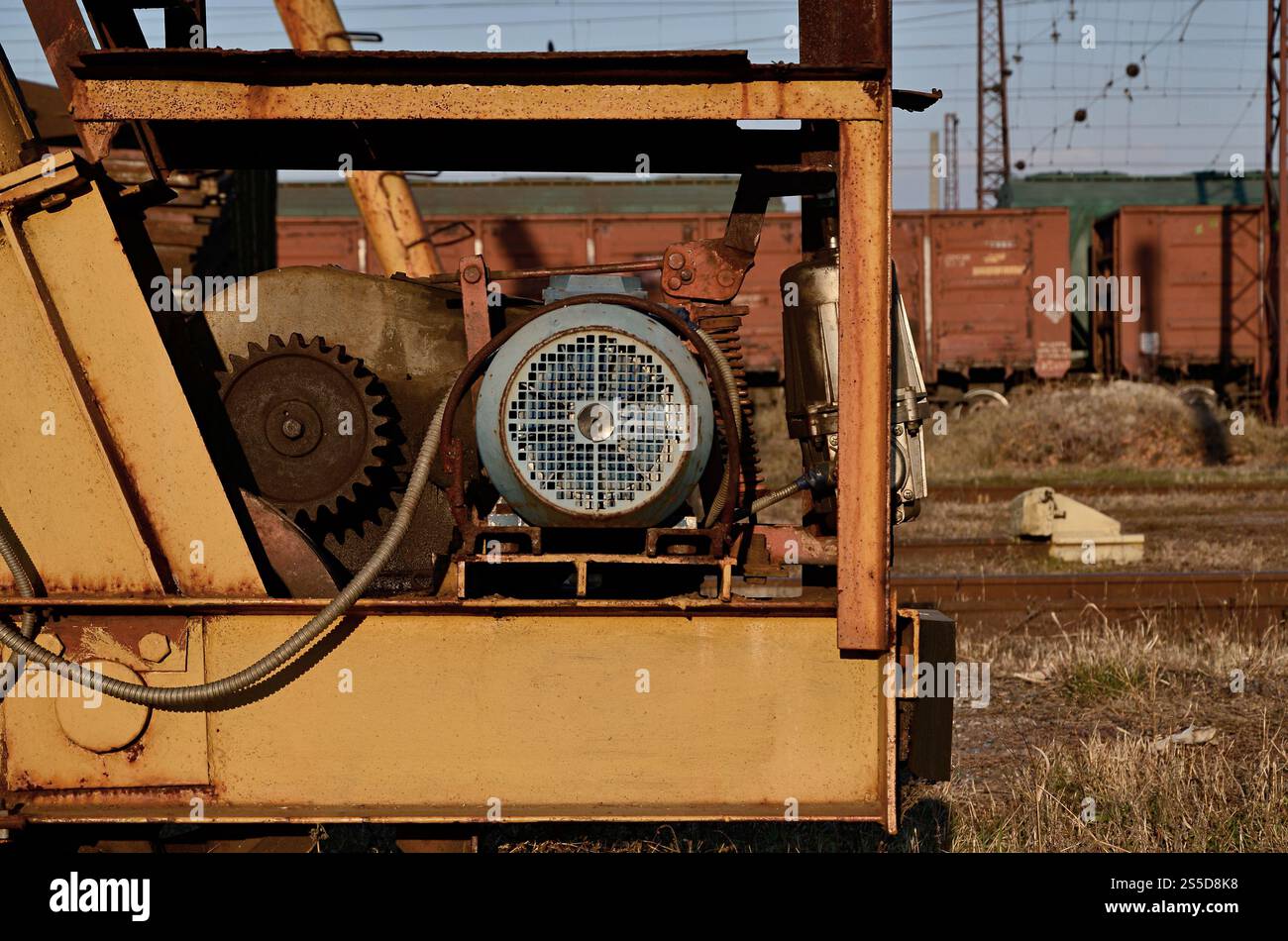 Old and rusty ventilation mechanism from the railway crane. Ventilation mechanism from the crane Stock Photo