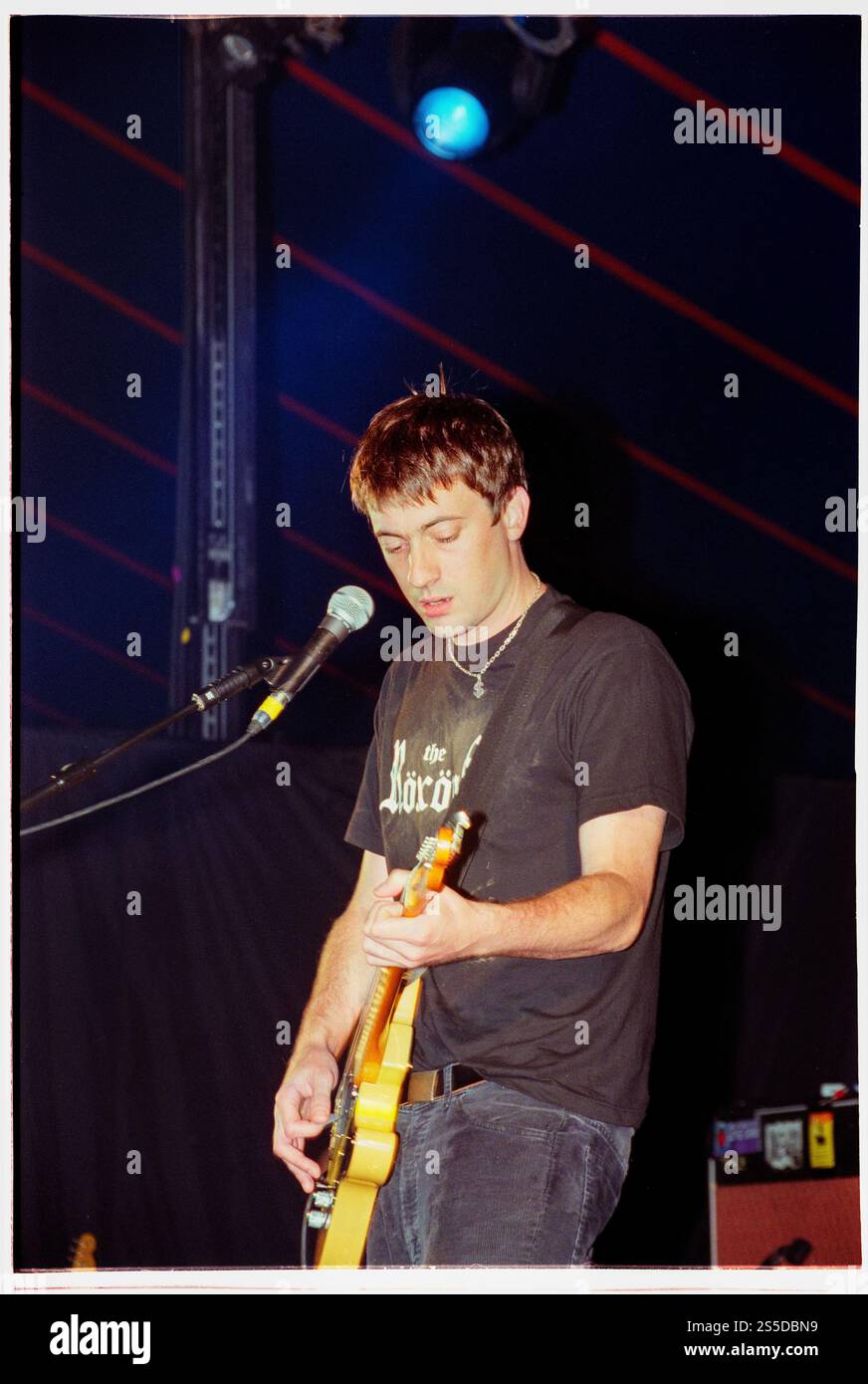 GRAHAM COXON, SOLO, READING FESTIVAL, 2000: Graham Coxon from Blur playing a Fender Telecaster solo on the Melody Maker Stage at Reading Festival on 26 August 2000. Photo: Rob Watkins.  INFO: Graham Coxon, known for his role as Blur's guitarist, embarked on a successful solo career marked by eclectic and experimental music. Albums like "Happiness in Magazines" and "A+E" showcased his unique songwriting, blending alternative rock, folk, and punk influences, establishing him as a distinctive solo artist. Stock Photo