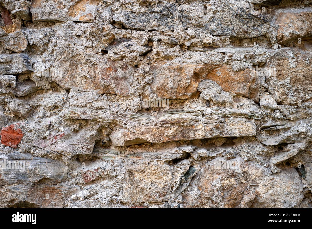 Close-up view of uneven bricks with rough texture Stock Photo