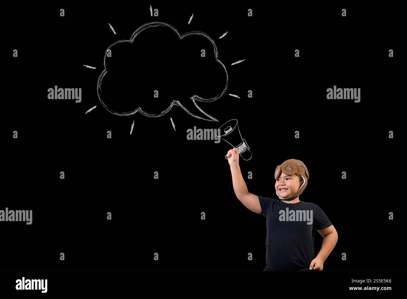 The boy pretends to be a superhero and uses a megaphone to amplify the sound. Draw concept. Stock Photo