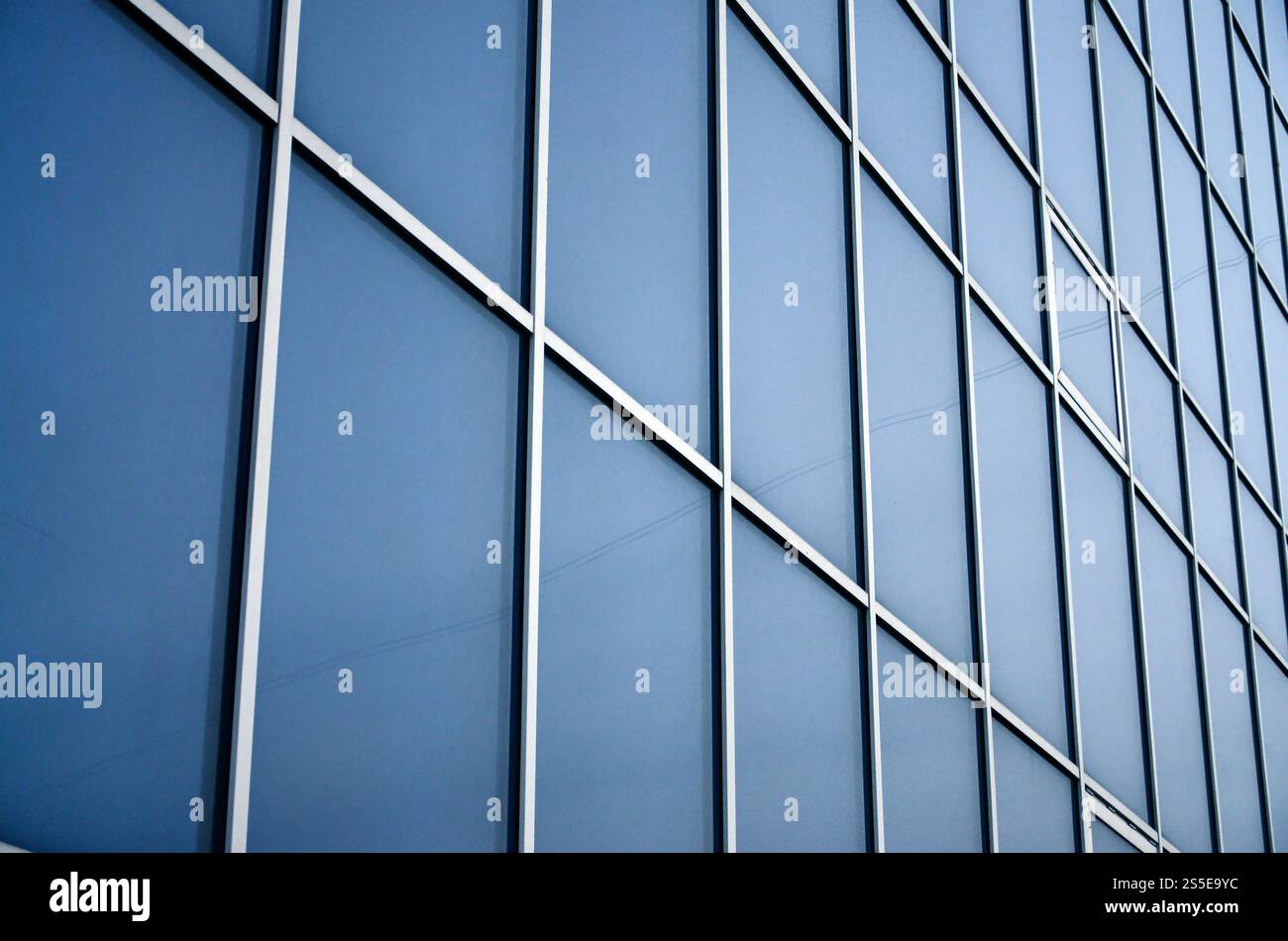Solid blue windows of the office building. Glass wall Stock Photo - Alamy