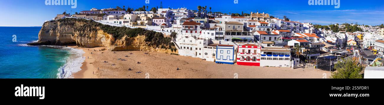 Portugal, beauiful  sunny Algarve coast. Panorama of scenic coastal town Carvoeiro with nice golden beach Stock Photo