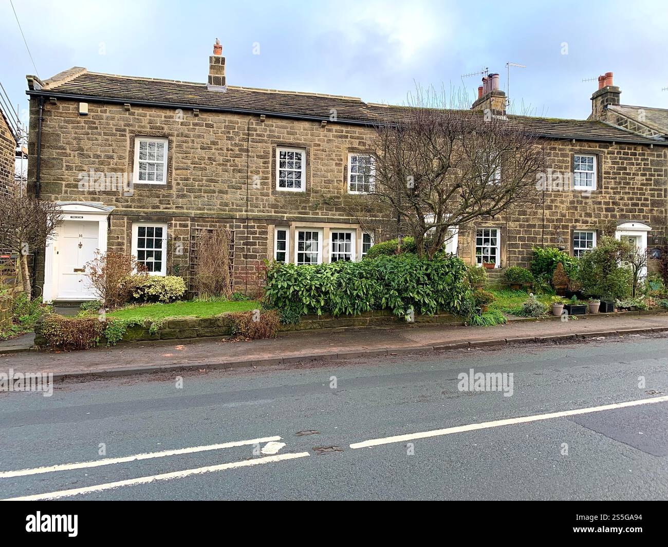 Burley in Wharfedale houses house West Yorkshire place live lived lives town Village Country England British UK stone type homes family families old - Smartphone Captured Stock Image