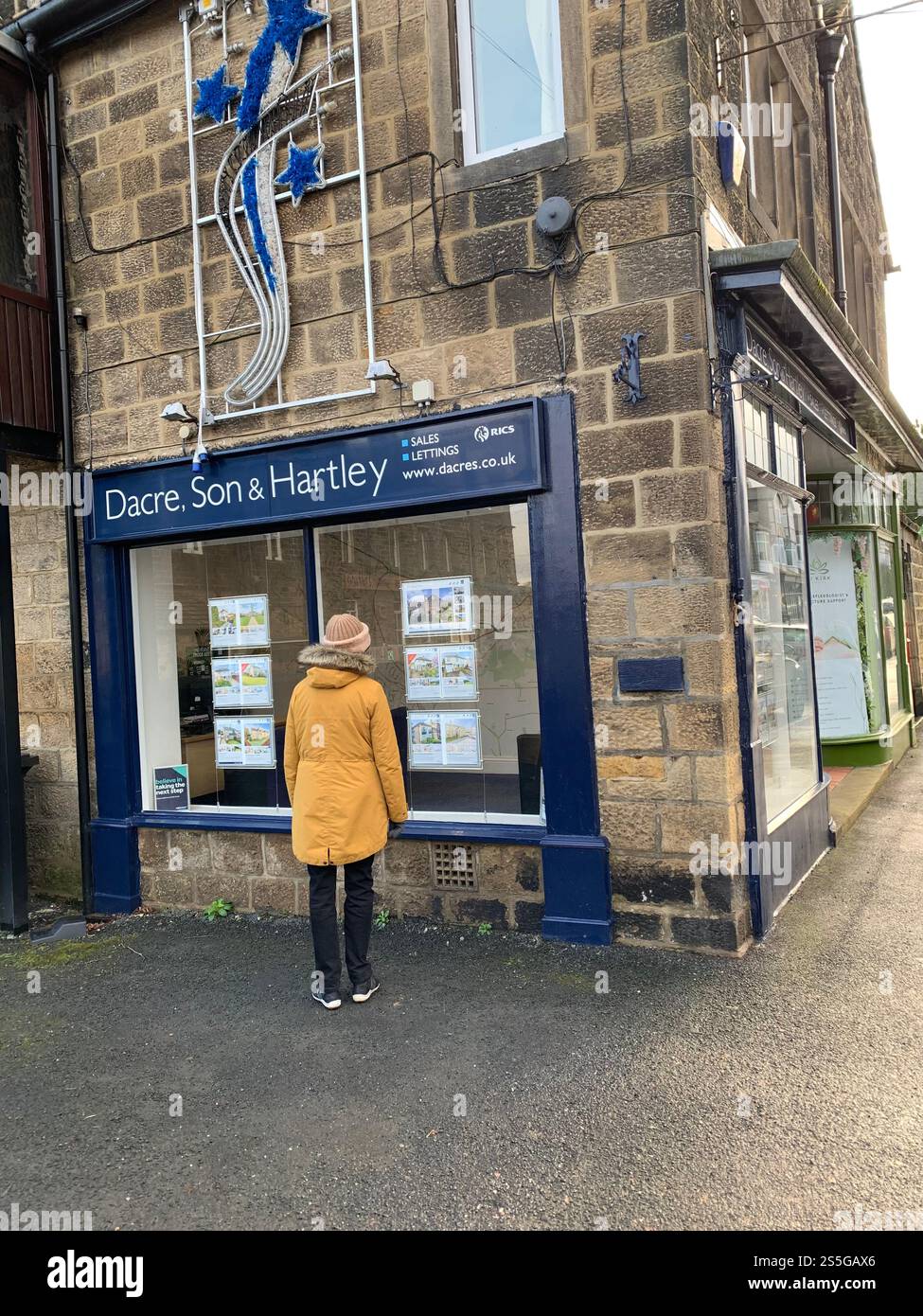 Burley in Wharfedale houses house West Yorkshire place live lived lives town Village Country England British UK stone type homes family families old - Smartphone Captured Stock Image