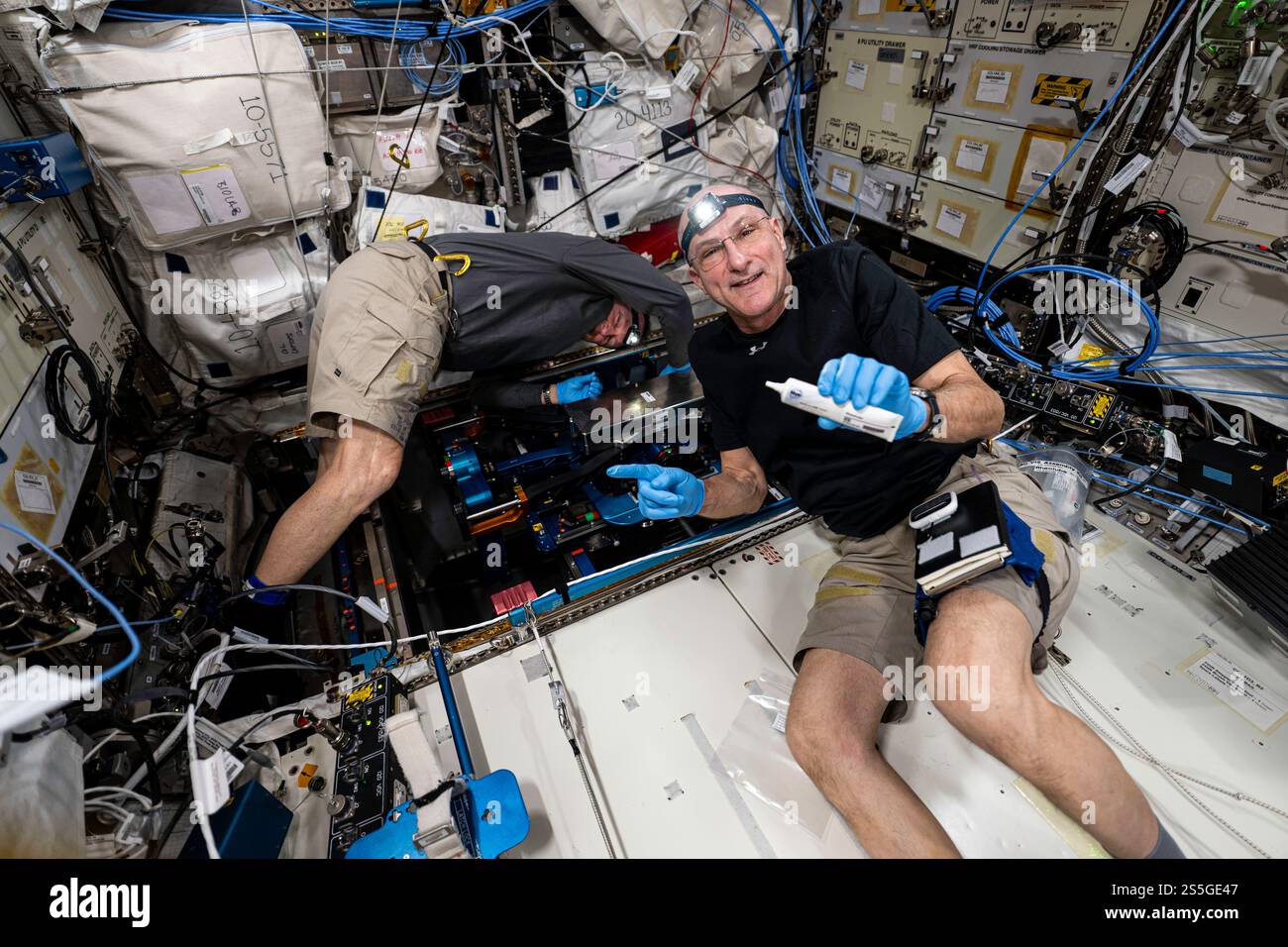 ISS - 19 December 2024 - NASA astronauts (from left) Butch Wilmore and Don Pettit, both Expedition 72 flight engineers, install the European Enhanced Stock Photo
