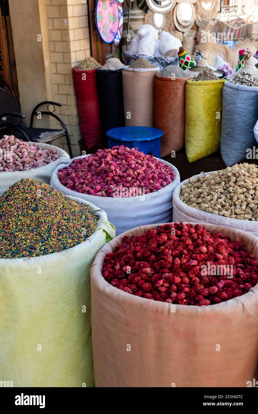 Spices in colorful bins in a store in the streets of the Marrakech Medina in Morocco Stock Photo