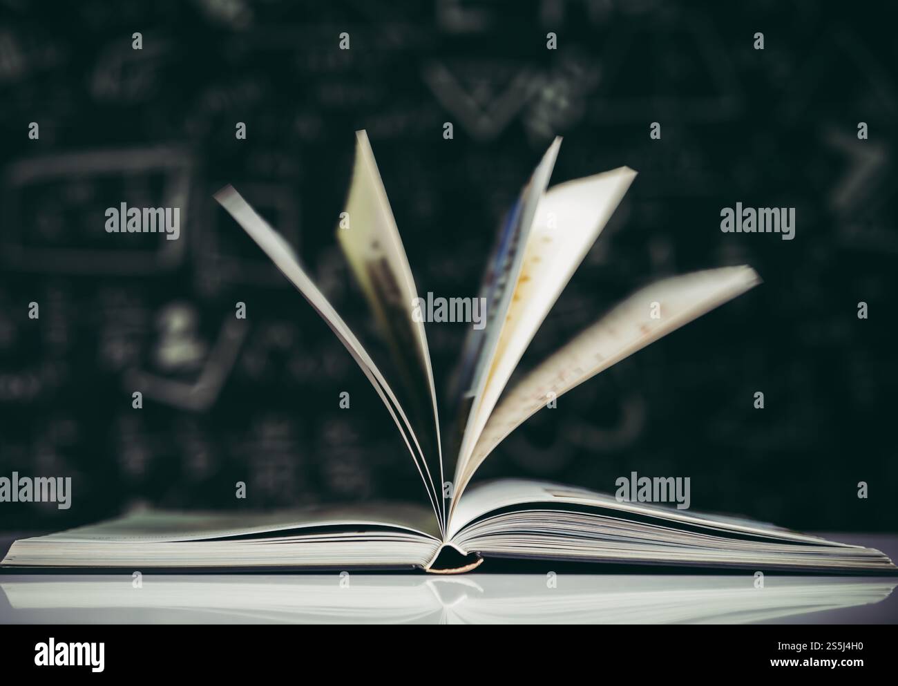 An open book placed in the classroom Stock Photo