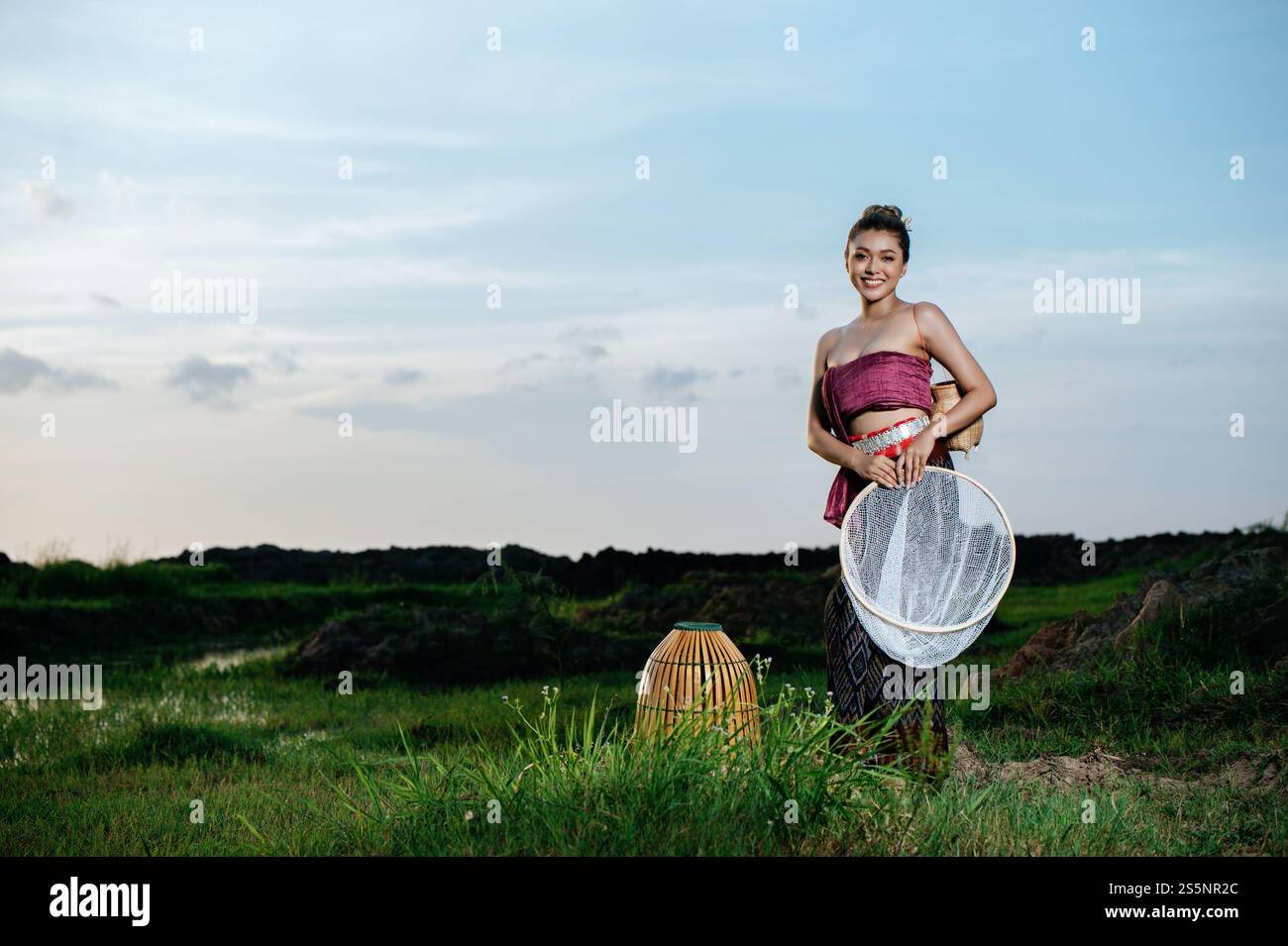 Chinese Rice Trap Portrait Young pretty Asian woman in beautiful Thai traditional clothes ...
