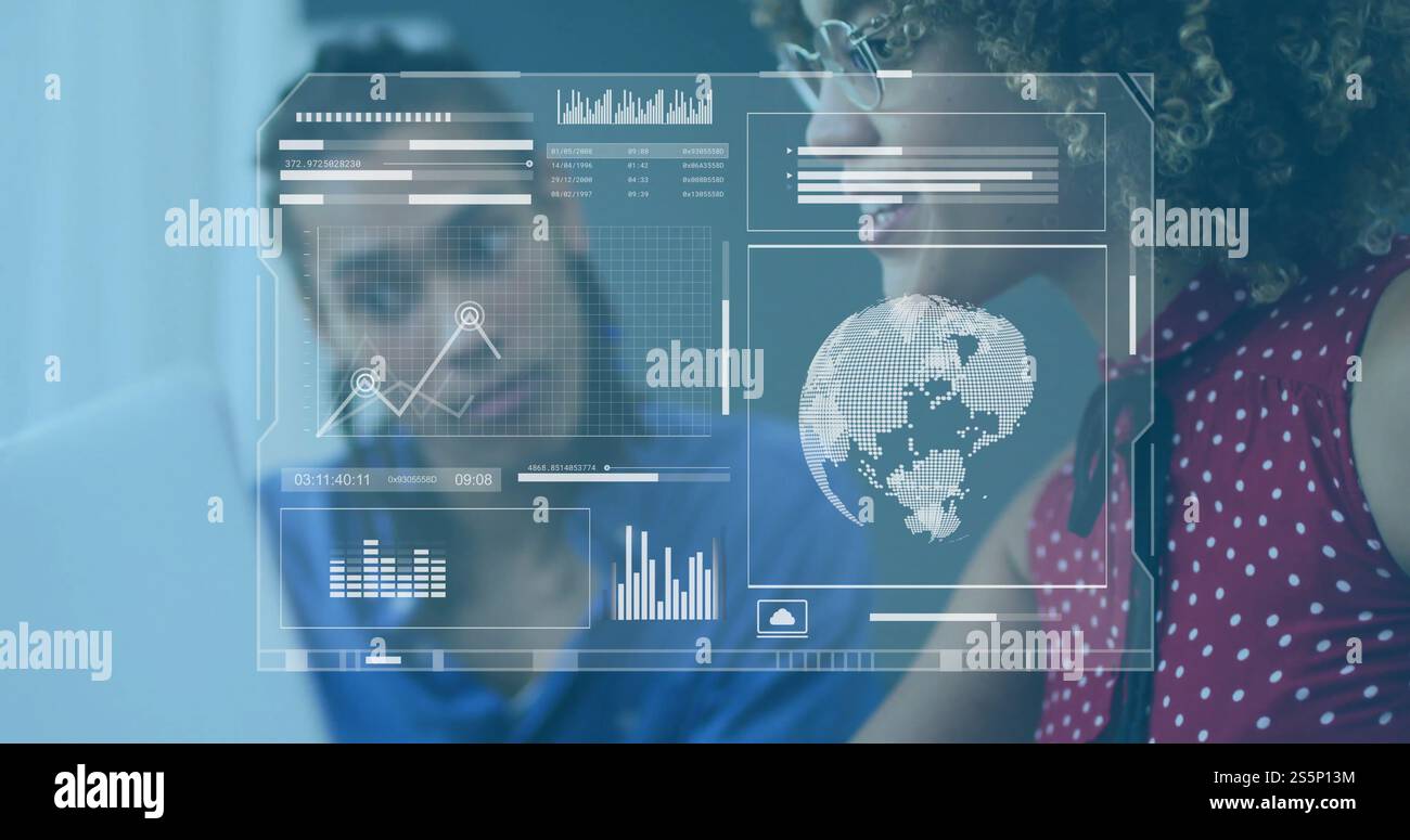 Image of processing data interface over diverse colleagues at laptop in office Stock Photo