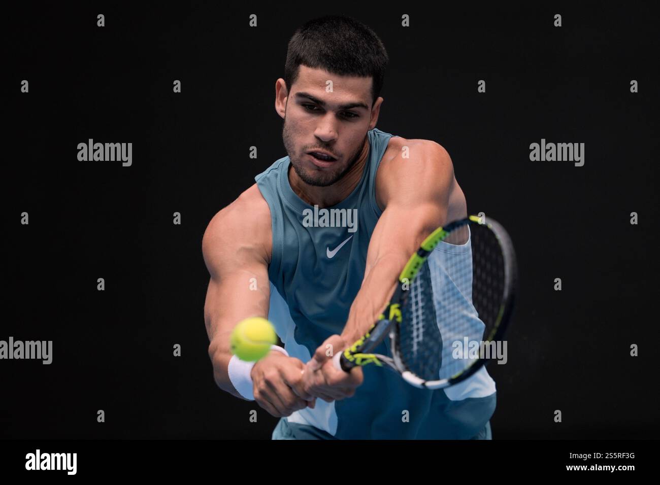 Carlos Alcaraz of Spain plays a backhand return to Yoshihito Nishioka