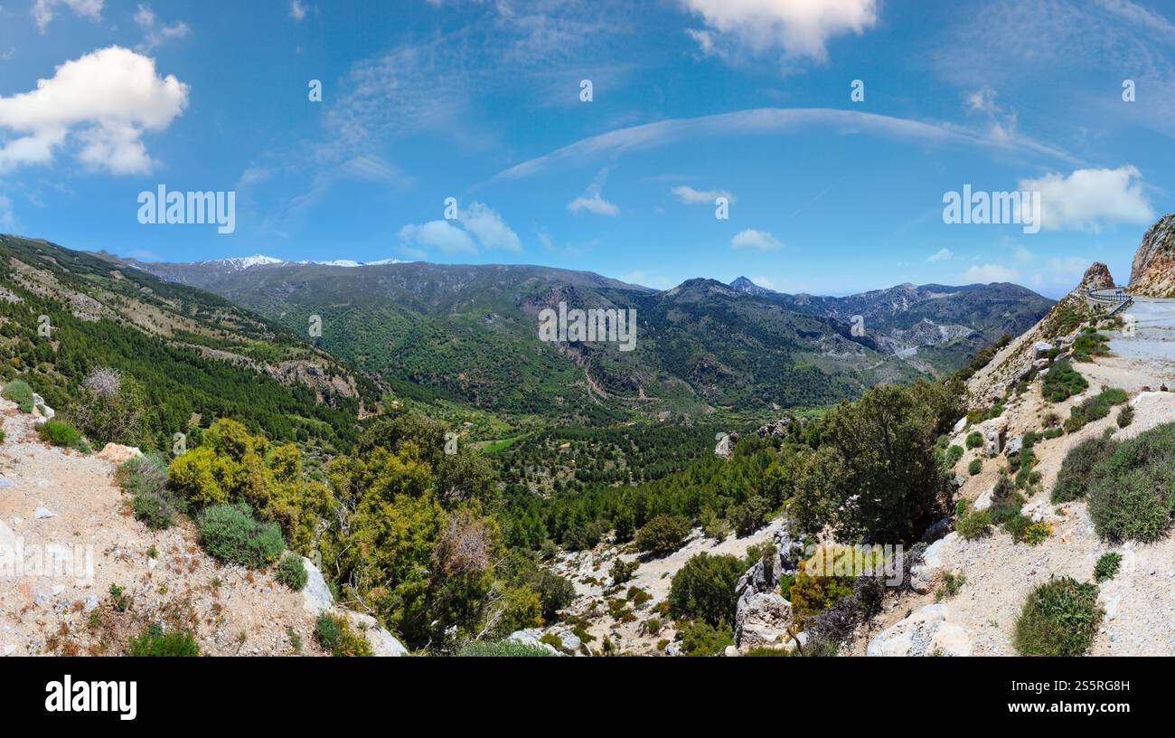Summer mountain landscape with snow on peak and road (Sierra Nevada