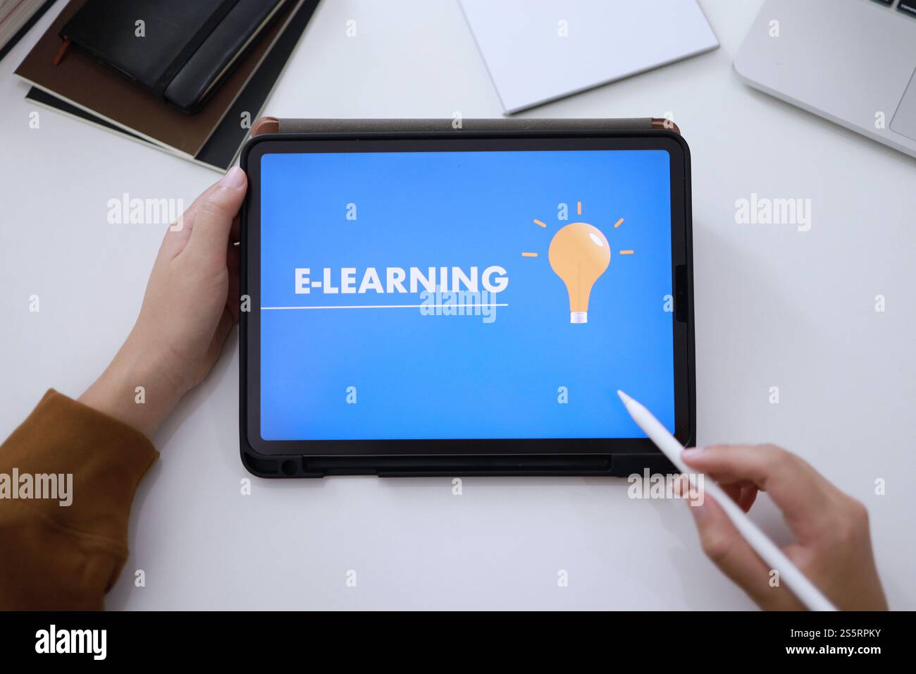 E-Learning concept with website on tablet. Education Internet Technology Web Online Stock Photo