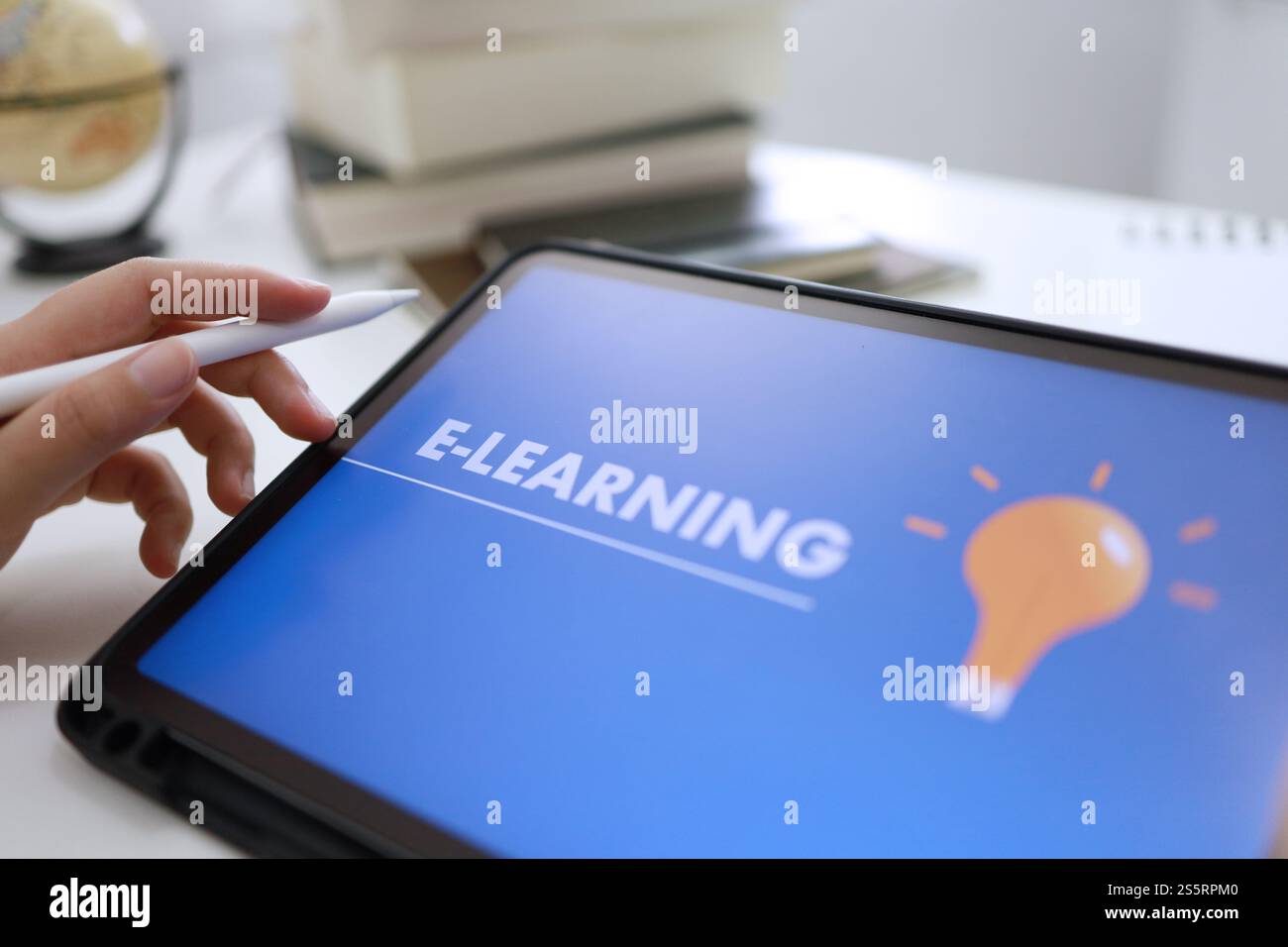 E-Learning concept with website on tablet. Education Internet Technology Web Online Stock Photo