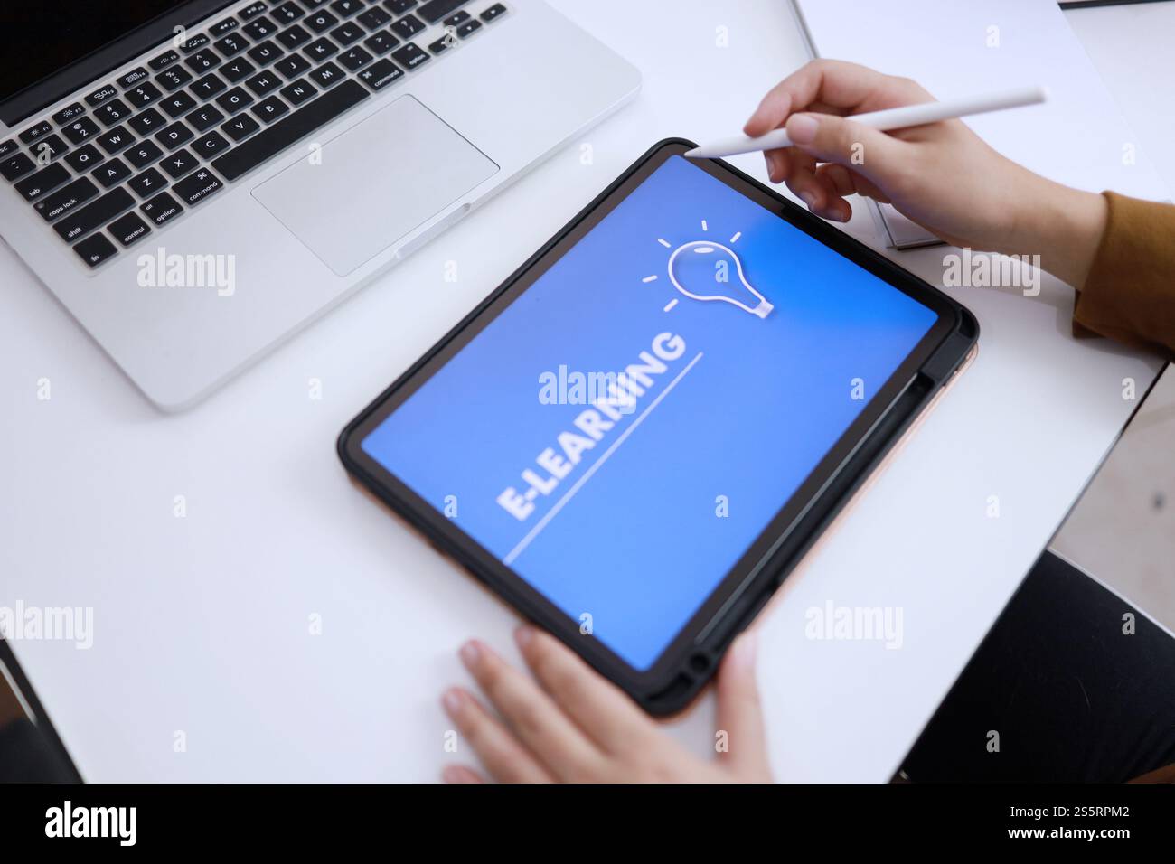 E-Learning concept with website on tablet. Education Internet Technology Web Online Stock Photo