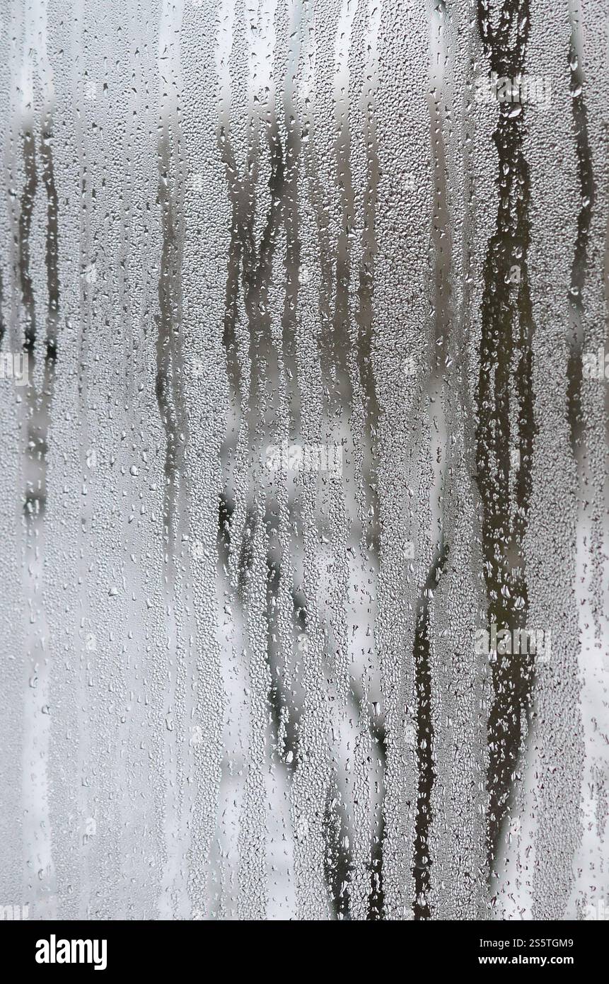The texture of a misted glass with a lot of drops and condensation ...