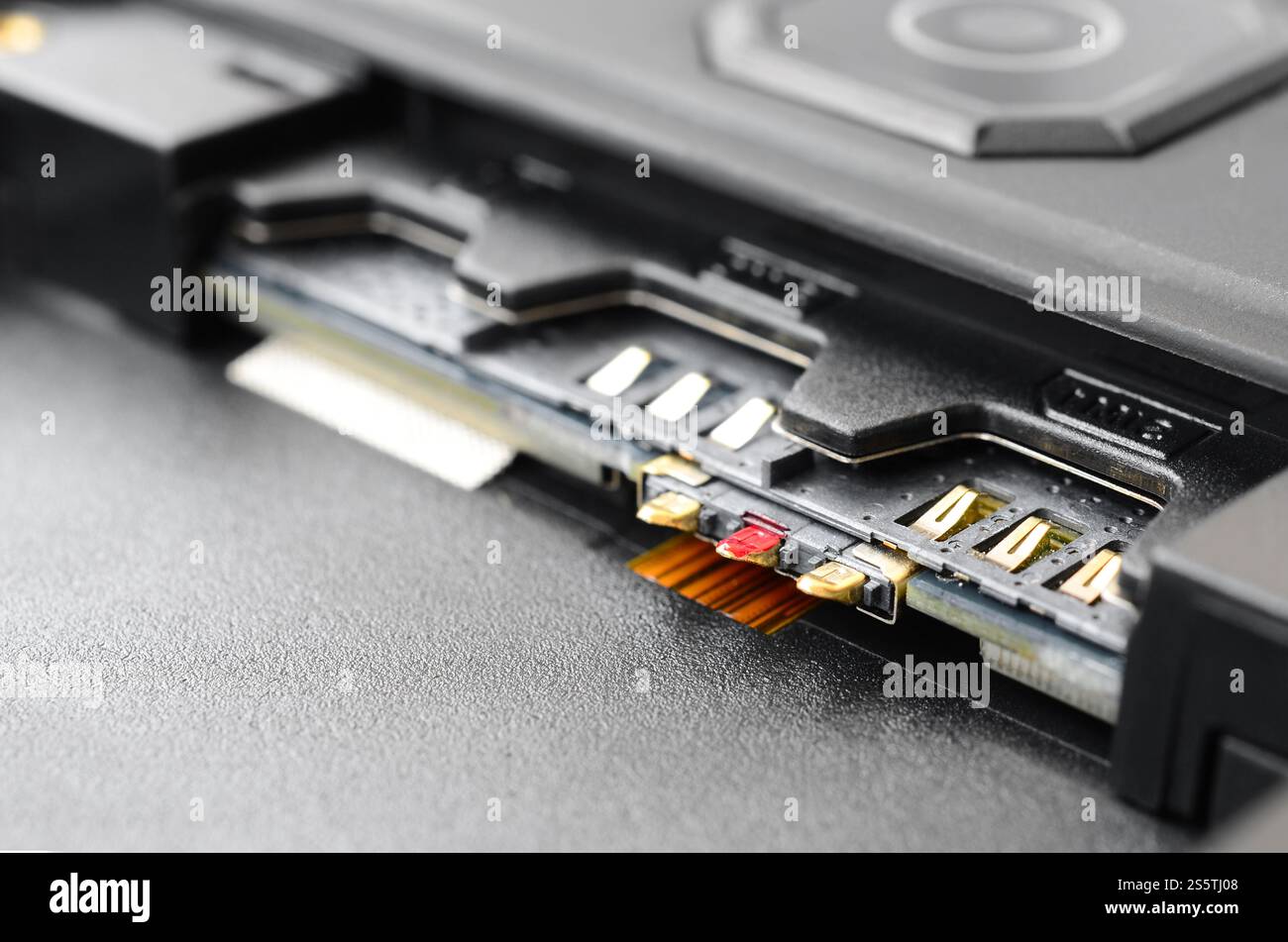 Broadband 5G mobile communication technology concept. Dual SIM card slot in modern smartphone. SIM stores international mobile subscriber identity Stock Photo