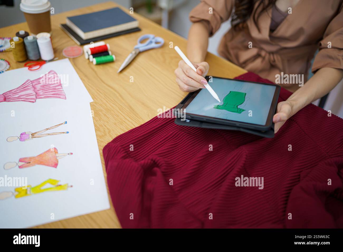 Start-up Stylish Fashion Designer work as sketch of new collection in atelier. Creative Design Concept Stock Photo