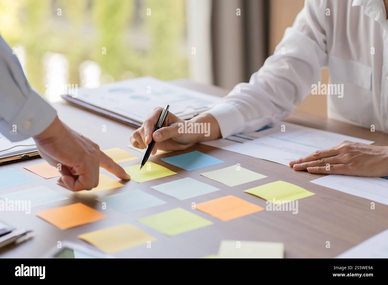 Business People brainstorming Meeting Design Ideas use post it notes to ...