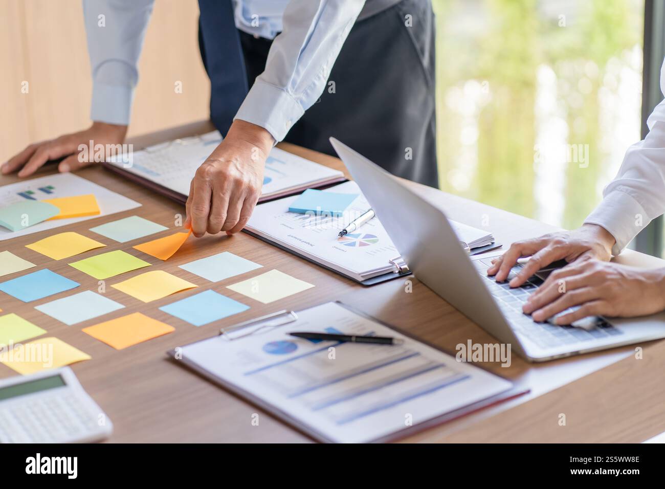 Business People brainstorming Meeting Design Ideas use post it notes to ...