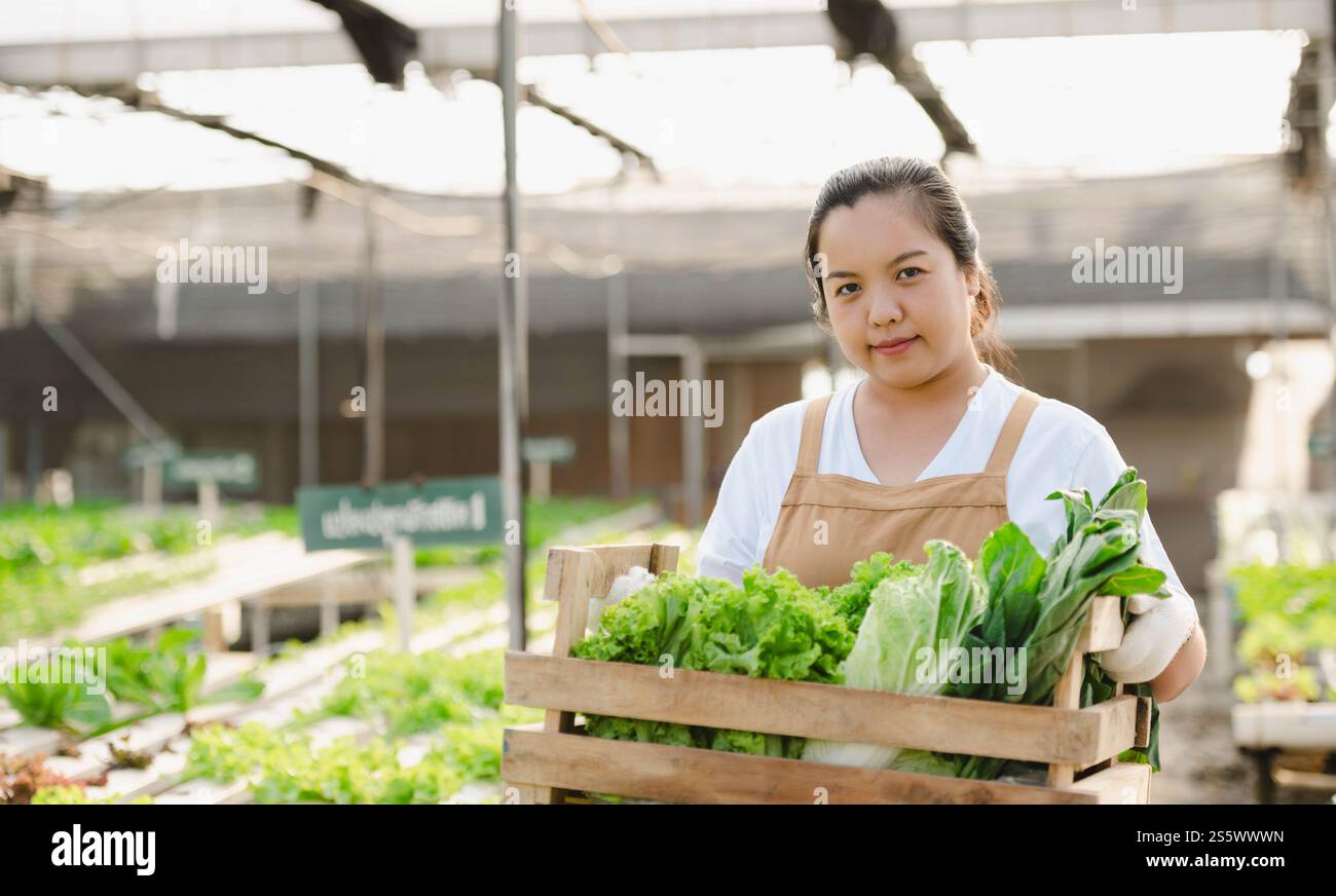 Portrait of Asian farmer woman holding wooden box full of fresh raw ...